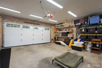 Garage with plenty of storage and brand new garage door