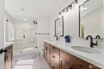 Upper level bath with double sinks and beautiful tiled shower