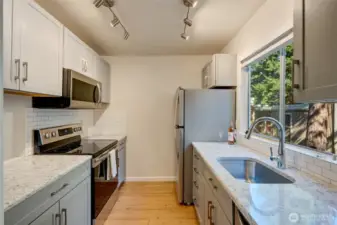 Welcome Home! Newer kitchen featuring Thomasville cabinetry.