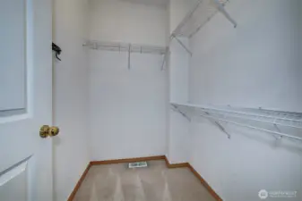 Primary bedroom walk-in closet