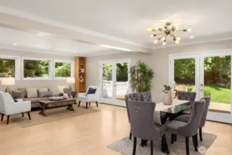Great room & dining area with patio doors that open to backyard