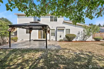 Enjoy summer evenings, BBQs, and year round gatherings in this backyard!