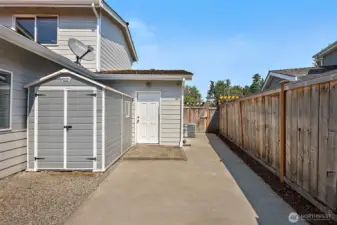 The perfect concrete slab to hide garbage cans, convenient shed for all the yard and garden tools.
