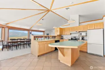 Open concept design unites living, dining, and kitchen—ideal for gatherings.