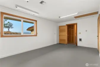 Versatile home office or work space, perfect for remote work, or media-room, gear room, exercise/yoga, or space for movie nights.  An all around hobby room.