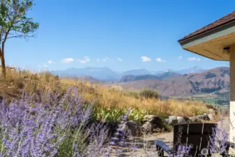 Concrete patios extend outdoor living while showcasing dramatic vistas.