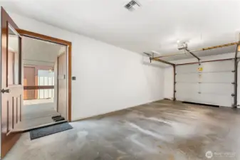 Detached carport and single-car garage provide ample covered parking.