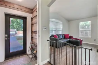 Home has a charming covered entryway. A great place to take off the rainboots.