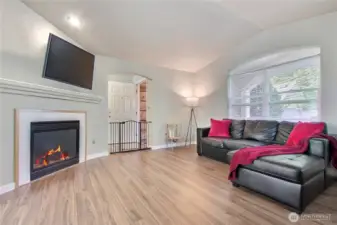 Spacious living room complete with gas fireplace to stay cozy on cool fall days or cold winter nights.