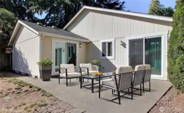 Patio is virtually staged. Great for entertaining. Accessed from dining area and the Primary bedroom.