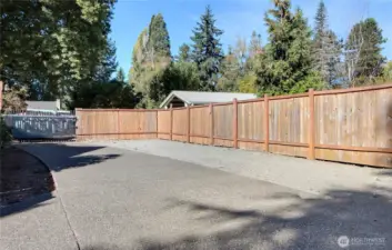 Front Driveway inside gate. Room for an RV. Plenty of parking. Gate is manual, and there is room outside of gate for additional vehicles too.