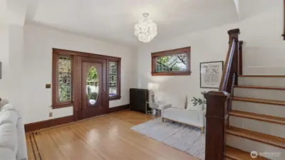 Spacious entry with original woodwork, high ceilings, lots of light.