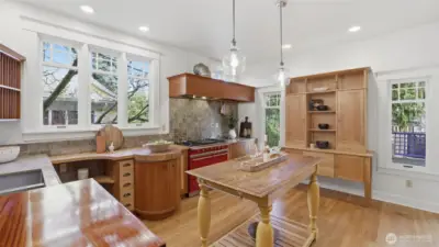 Custom French-country style kitchen with Lacanche range, Thermador hood vent, Sub-Zero Fridge, limestone counters & lots of storage