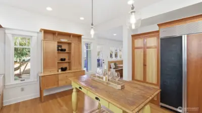 Custom French-country style kitchen with Lacanche range, Thermador hood vent, Sub-Zero Fridge, limestone counters & lots of storage