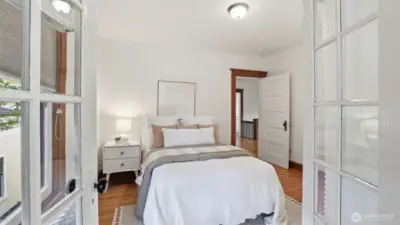 3 of 4 upstairs bedrooms. The bedrooms on the backside of the home share access to a flex space that runs the entire length of the home.