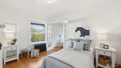 4 of 4 upstairs bedrooms. The bedrooms on the backside of the home share access to a flex space that runs the entire length of the home.
