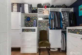 Primary's walk in custom closet system