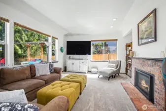 Living room with beautiful brick fireplace