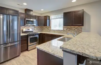 Kitchen with granite counter tops.