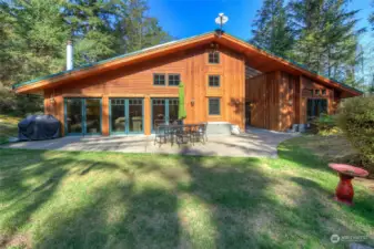 Three sets of French doors lead out to patio