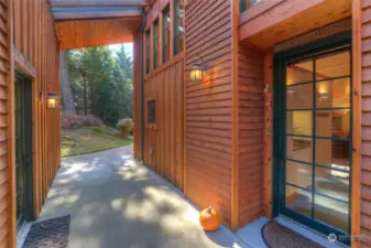 Breezeway with front door to the right, second bedroom/office to the left