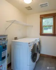 Utility room with 2023 water heater