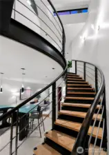 Floating steel staircase is the centerpiece of the home!