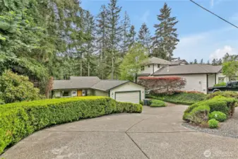 This home is perfectly nestled in a beautifully manicured, park-like setting.