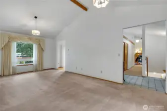 Impressive formal living and dining room with vaulted ceilings.