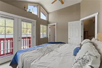 Primary bedroom with NW views of lake and mountains
