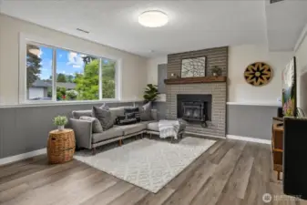 Lower level living room. Cozy up to the wood fireplace.