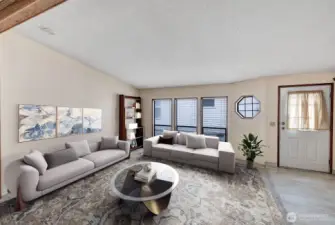 Tile at the formal entry into the home. Vaulted ceilings, textured walls, neutral color scheme and floor to ceiling windows are just some of the interior features of this home.