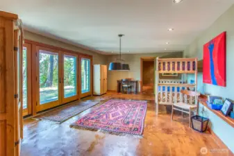 The rec area on the lower floor with a bonus room beyond