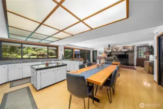 Notice the triple-bank of windows in the kitchen overlooking the serene of your private park.
