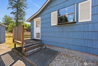 A convenient door leads to the mudroom, providing easy access to both the detached garage and the spacious yard.