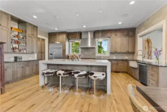 Large Kitchen with Cerused oak finish Plato custom cabinetry   Miele appliances – Large Island – eight burner range with double oven, warming drawer, dishwasher, refrigerator, freezer. Backsplash in kitchen is premium grade Italian tile