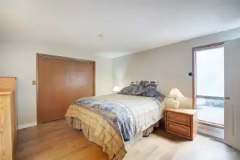 Primary bedroom located on the main level also has new flooring.