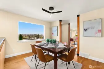 Dining area with views of Cascade Mountains.  Notice the light fixture...this home has a cool Mid-Century vibe.
