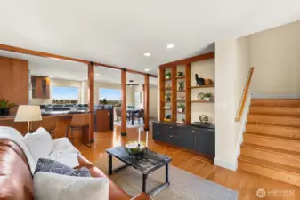 Another view of the TV/media area looking towards the kitchen.  There's even City views from the couch!  Lovely built-in shelves and bar seating.