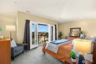 Very spacious primary bedroom with fantastic City views.  There's even a deck to have you morning coffee.