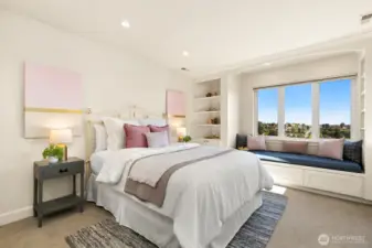 One of 3 bedrooms upstairs.  This bedroom has a charming built-in bench and storage space.    It's my favorite room...