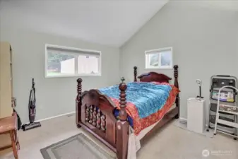 Bedroom with vaulted ceilings.