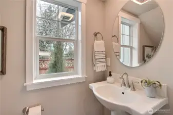 **Photos are of Unit B, for illustrative purposes only. Unit C has all the same finishes w/reversed floor plan.** First-floor powder bathroom.