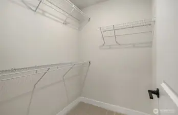 Walk-in closet in secondary bedroom suite