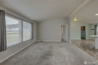 Family room with large windows and lots of natural light.