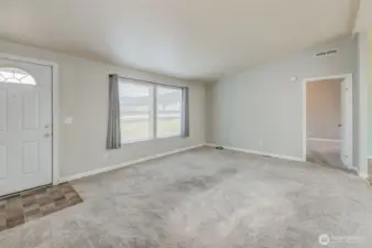 Front entrance off of family room. Primary bedroom is straight ahead.