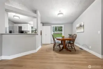 Bright and open, the kitchen flows naturally into the adjacent living areas. The dining area offers a comfortable space for meals or gatherings. Natural light enhances the inviting atmosphere. It’s a perfect spot to enjoy good food and great company.