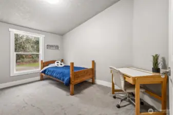 Each bedroom features vaulted ceilings and crisp, clean finishes.