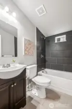 Both bathrooms have been refreshed with stylish tile and updated fixtures. The modern touches elevate the entire home’s aesthetic. It’s a move-in-ready upgrade that adds lasting value.
