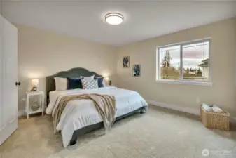 Primary suite with K-I-N-G Sized bed, room for side tables and more! NEW carpet & FRESH paint! Attached 5-Piece bath and large WIC.